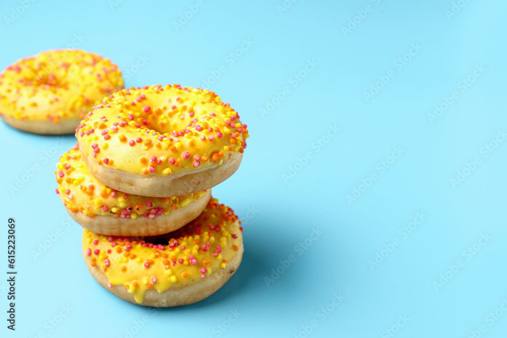 Sweet donuts on blue background