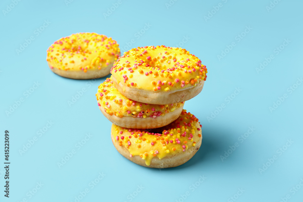 Sweet donuts on blue background