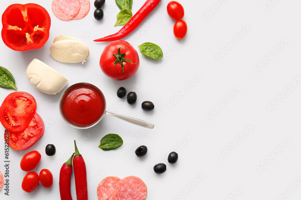 Fresh ingredients for preparing pizza on white background