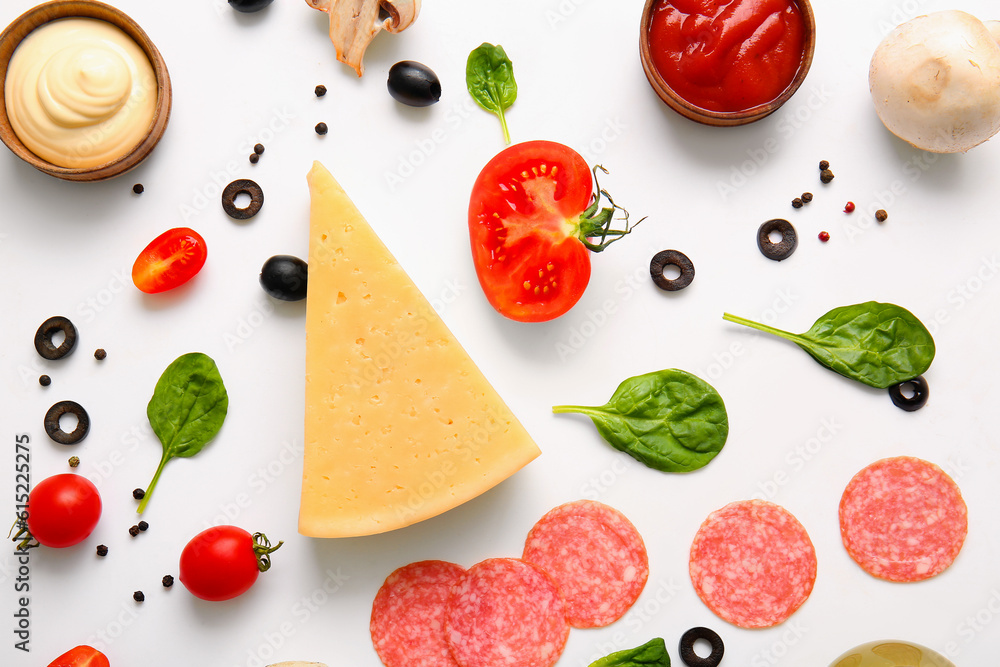 Fresh ingredients for preparing pizza on white background