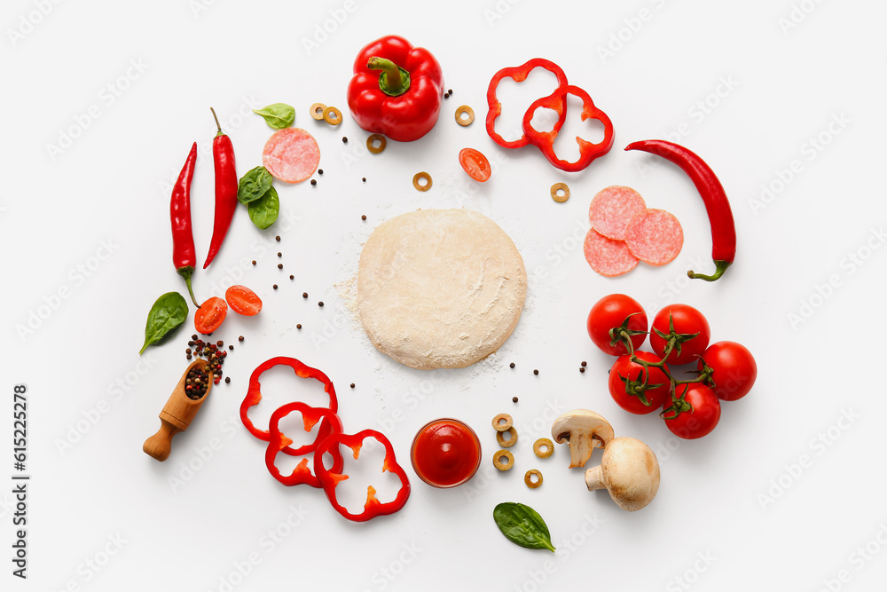 Raw dough and ingredients for preparing pizza on white background