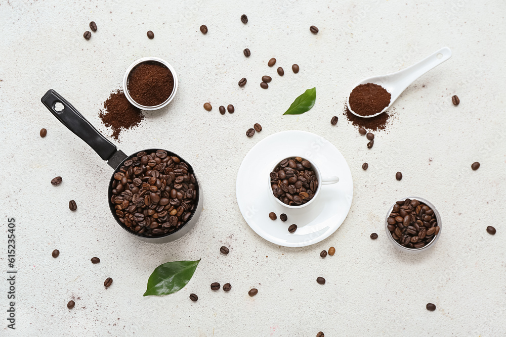 Cezve and cup with coffee beans on light background