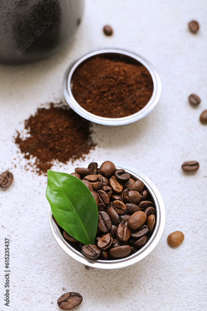 Bowl with coffee beans on light background