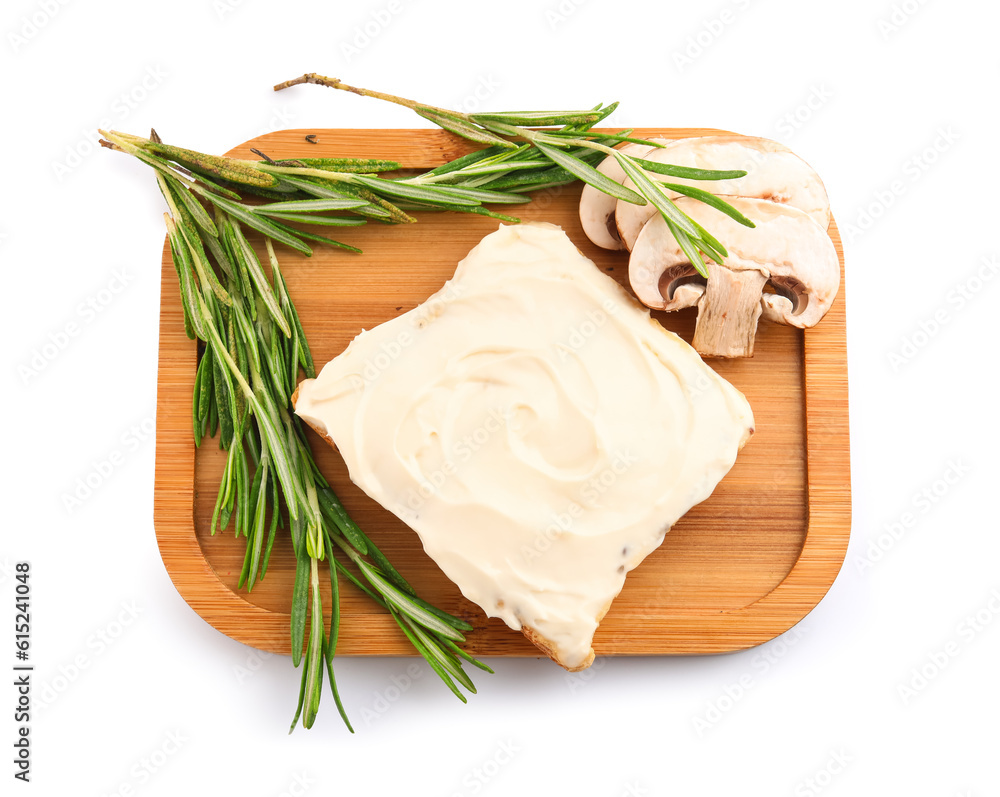 Wooden board of tasty toast with cream cheese on white background