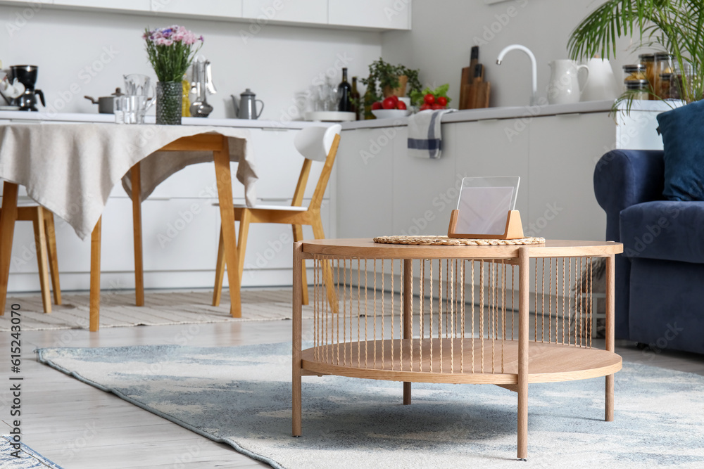 Wooden coffee table in interior of open plan kitchen