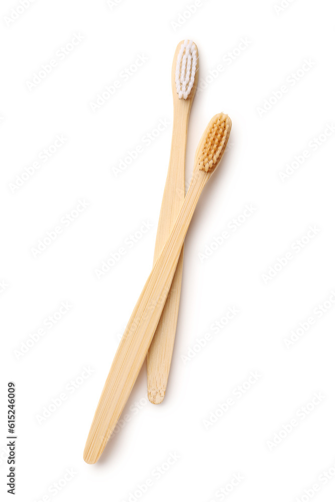 Different bamboo toothbrushes on white background