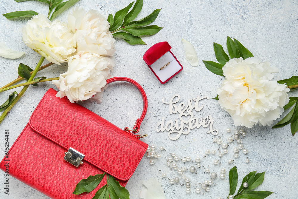 Composition with text BEST DAY EVER, stylish female accessories and peony flowers on light backgroun