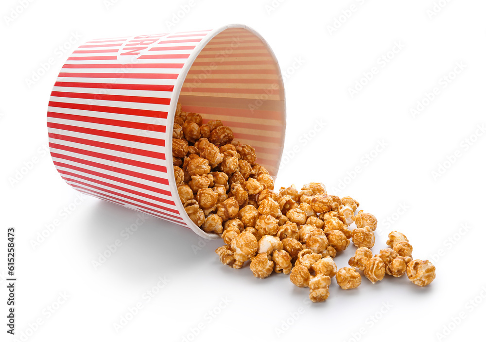 Bucket of tasty caramel popcorn isolated on white background