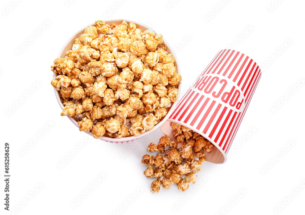 Buckets of tasty caramel popcorn isolated on white background