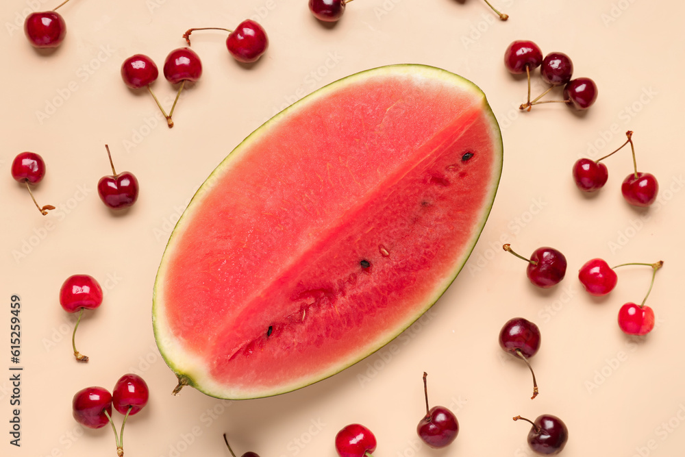 Piece of fresh watermelon and cherries on orange background