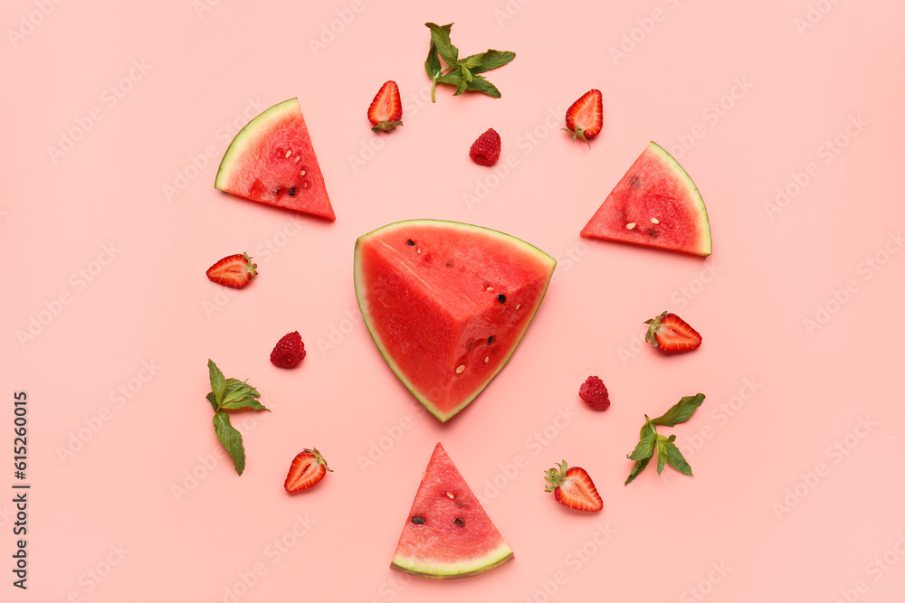 Pieces of fresh watermelon and different berries on pink background