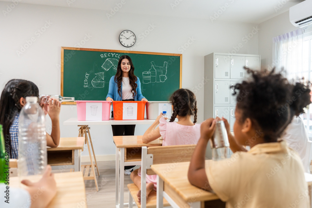 Group of student learn with teacher in classroom at elementary school. 