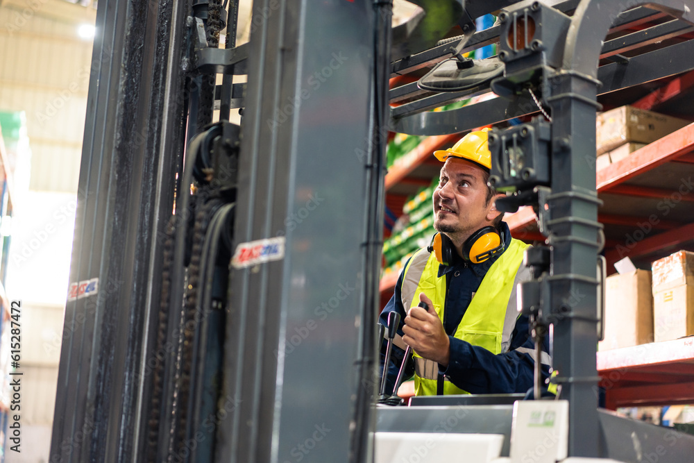 Caucasian attractive man industrial worker work in manufacturing plant. 