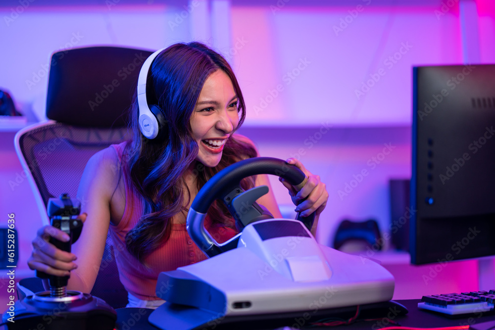 Caucasian e-sport woman gamer playing online video game on computer. 