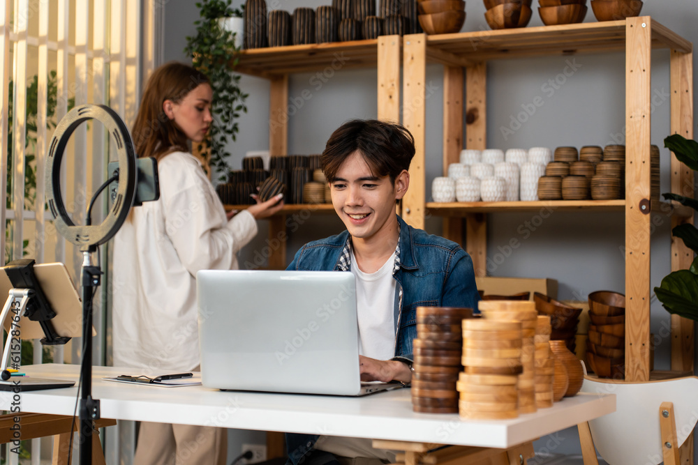 Caucasian man and woman sell vase product online live stream at home. 