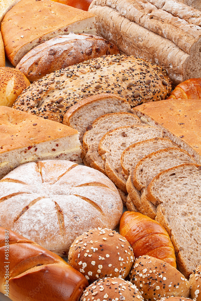 various fresh bread as background.