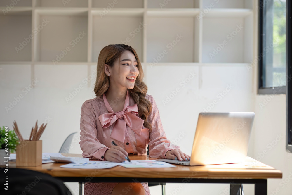 Business woman using calculator for do math finance on wooden desk in office and business working ba