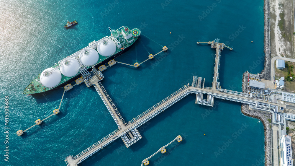 LNG (Liquified Natural Gas) tanker anchored in Gas terminal gas tanks for storage. Oil Crude Gas Tan