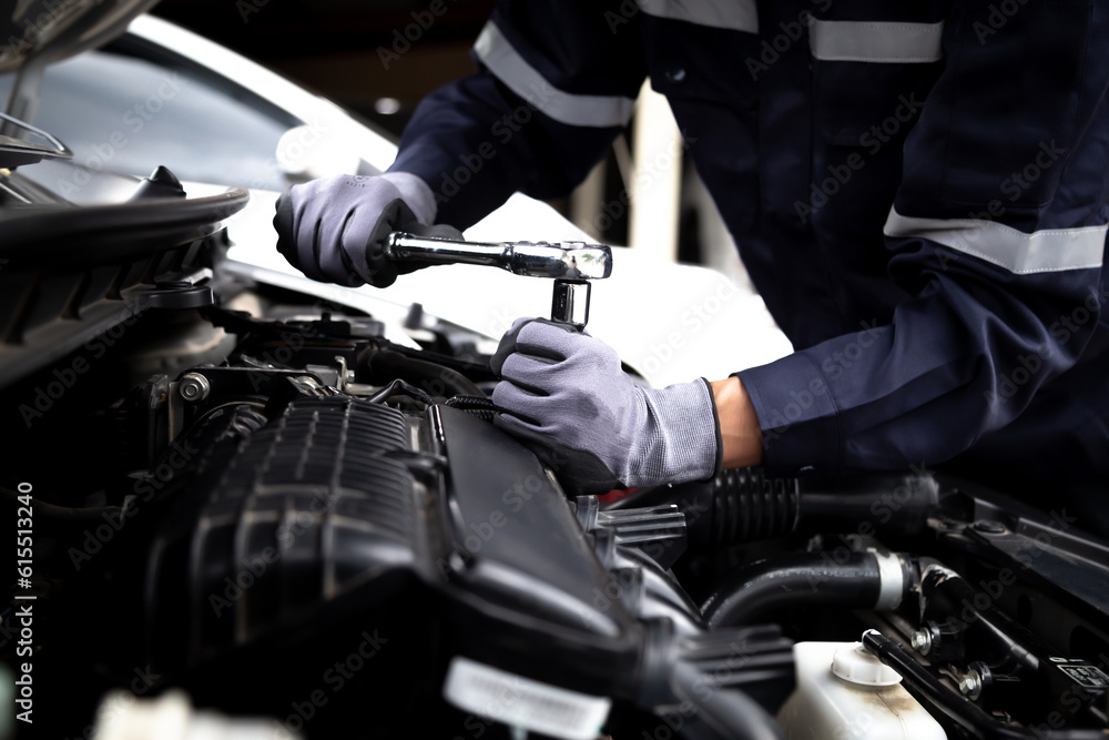 Auto mechanic working on car engine in mechanics garage.Repair service,car service, repair, maintena