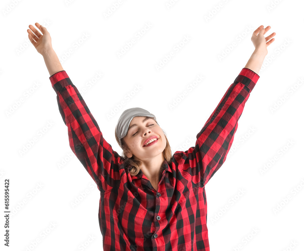 Young woman in checkered pajamas on white background