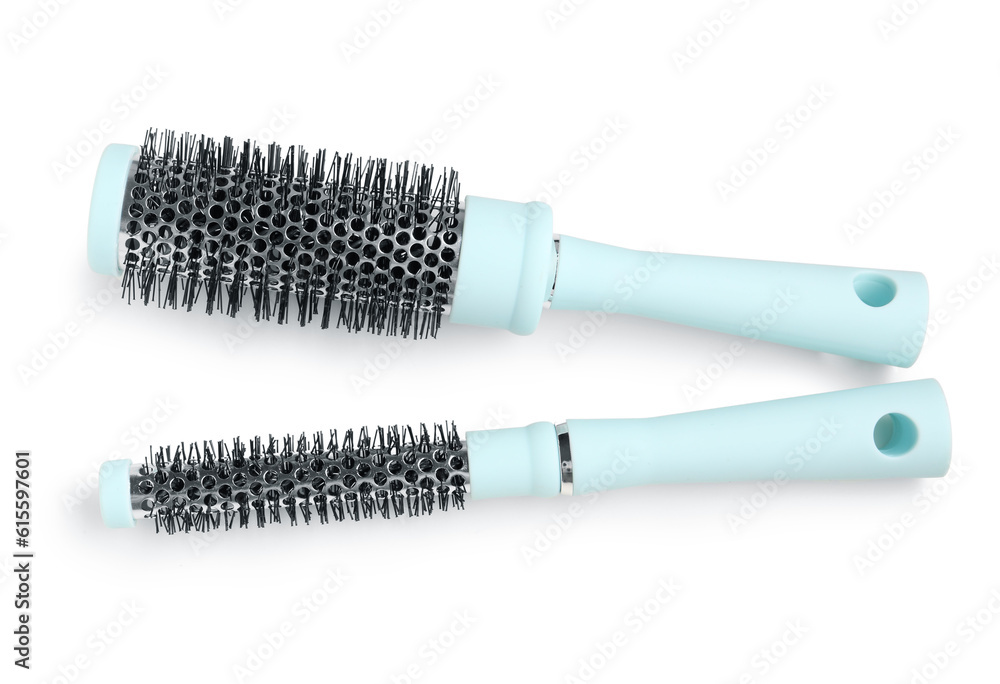 Round hair brushes on white background