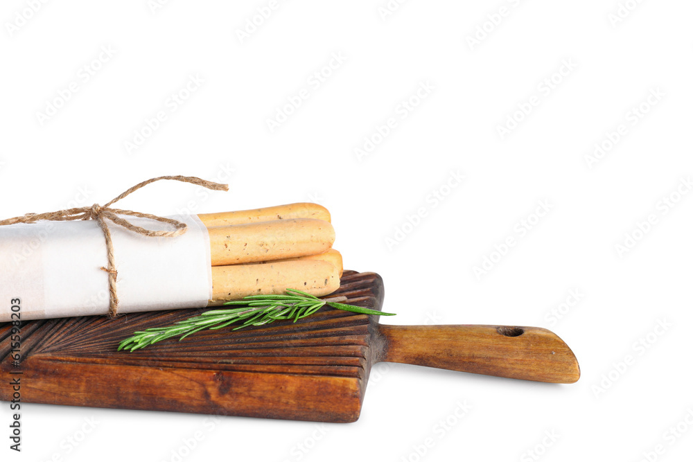 Wooden board with bunch of tasty Italian grissini on white background, closeup