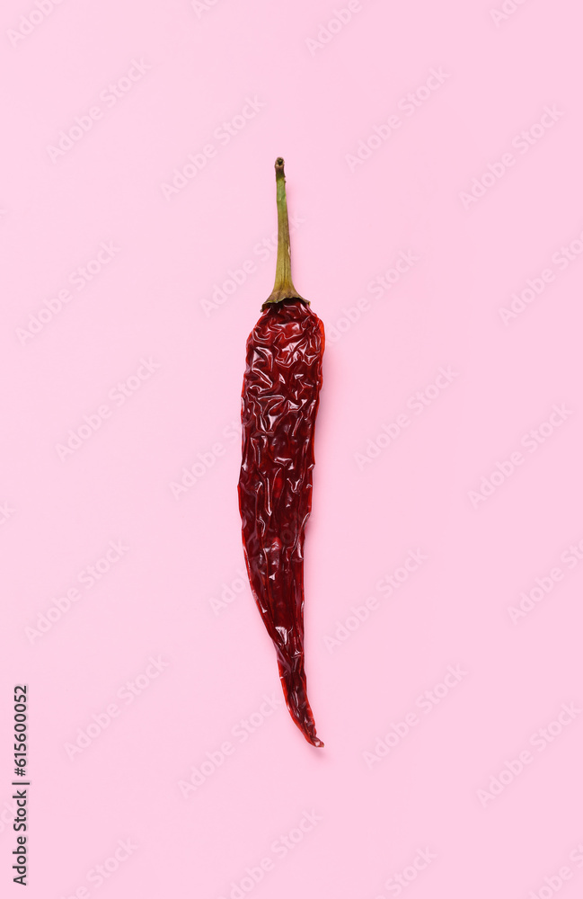 Dry hot chili pepper on pink background