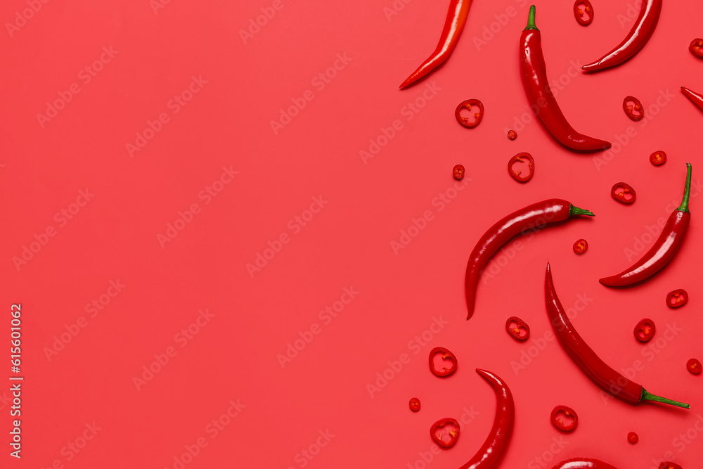 Fresh hot chili peppers on red background