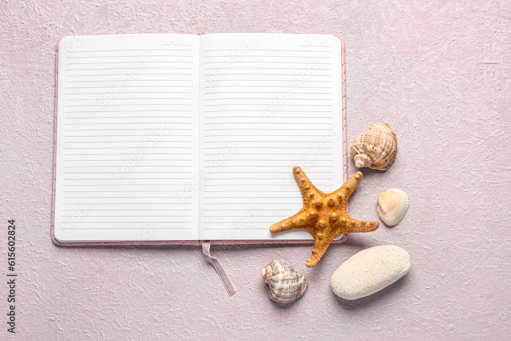 Blank notebook with seashells and starfish on lilac background