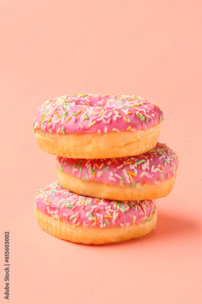 Sweet donuts on pink background