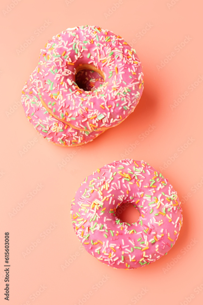 Sweet donuts on pink background