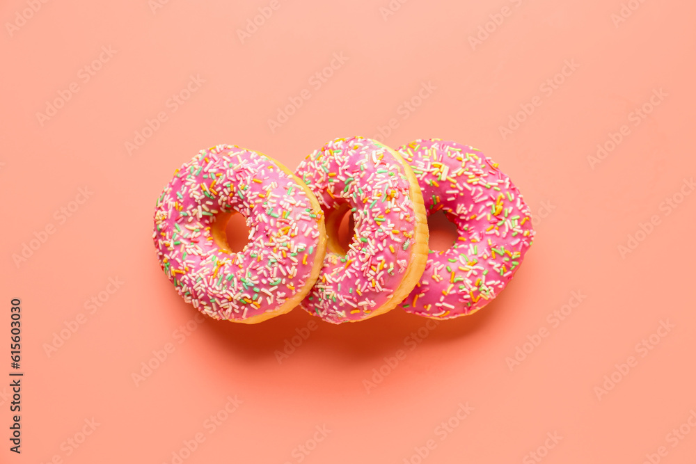 Sweet donuts on pink background