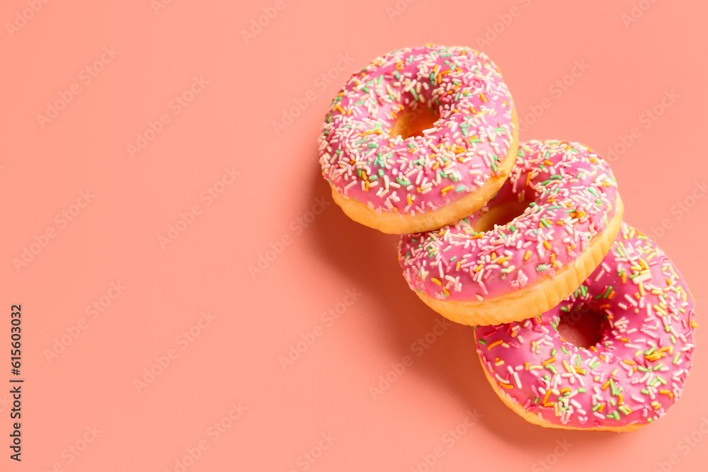 Sweet donuts on pink background