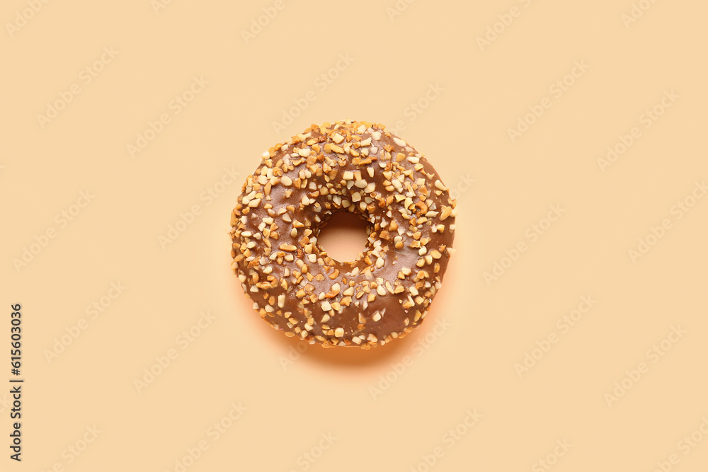 Sweet chocolate donut on beige background