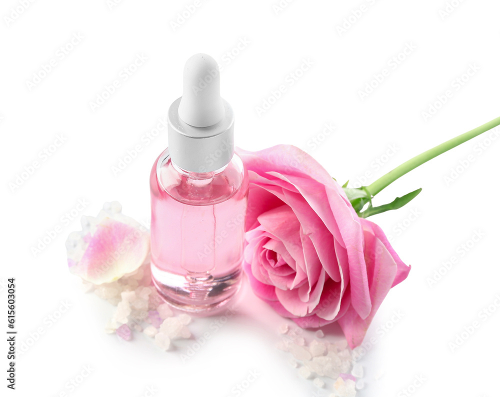 Bottle of cosmetic oil with rose extract and flower on white background