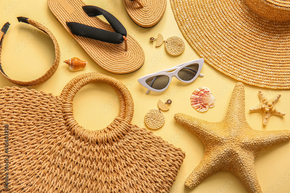 Stylish bag and different accessories on beige background