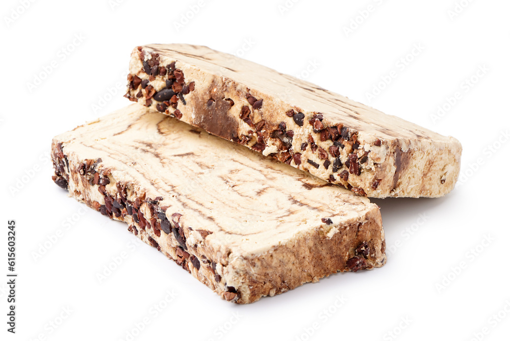 Pieces of tasty marble halva on white background