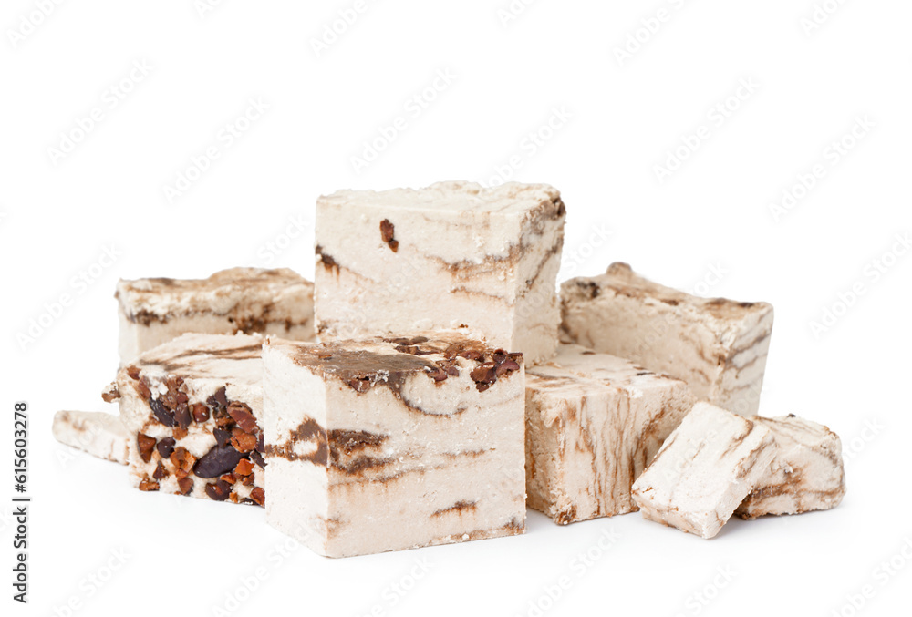 Pieces of tasty marble halva on white background