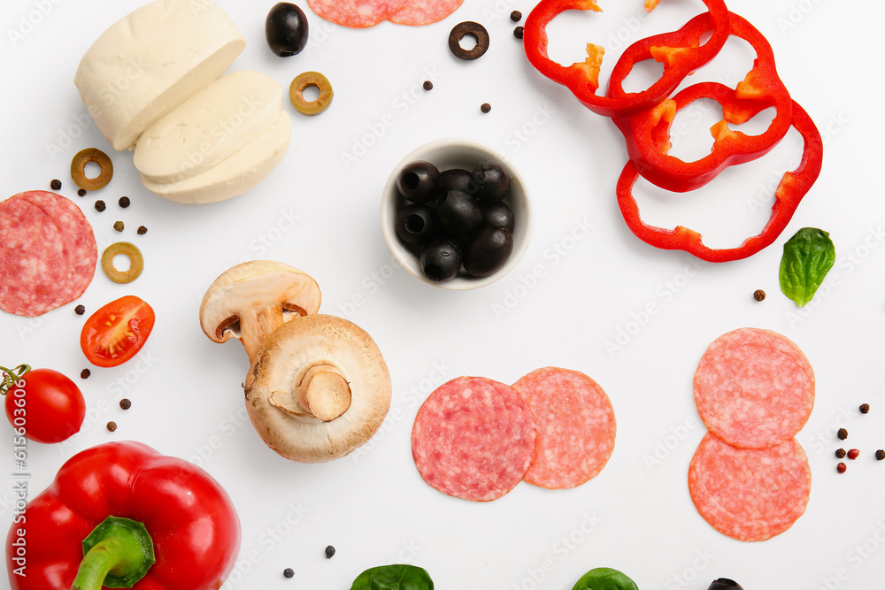 Fresh ingredients for preparing pizza on white background