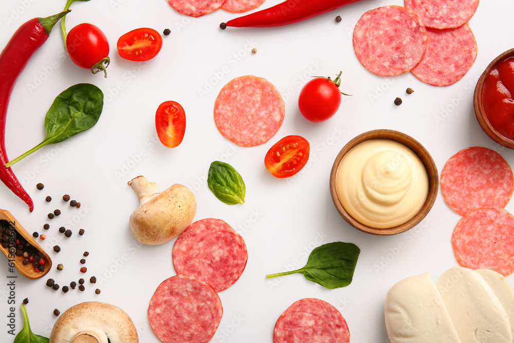 Fresh ingredients for preparing pizza on white background