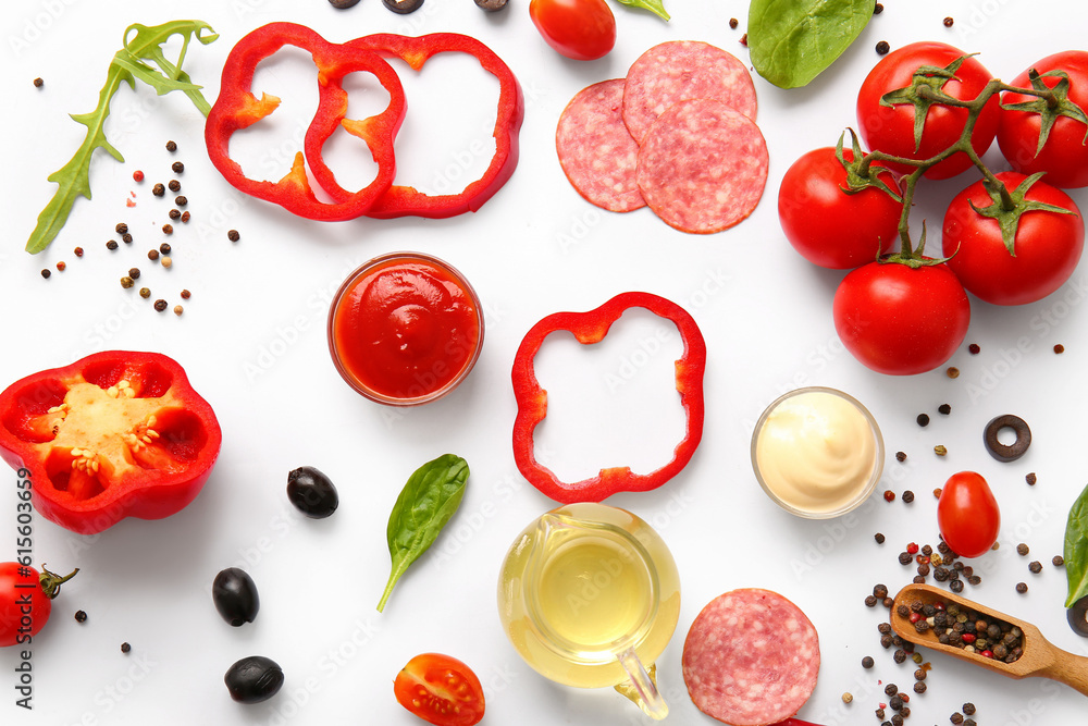 Fresh ingredients for preparing pizza on white background