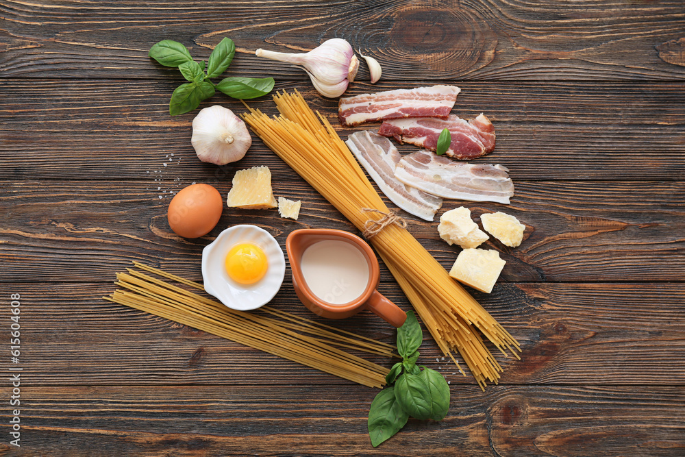 Ingredients for tasty pasta carbonara on wooden background