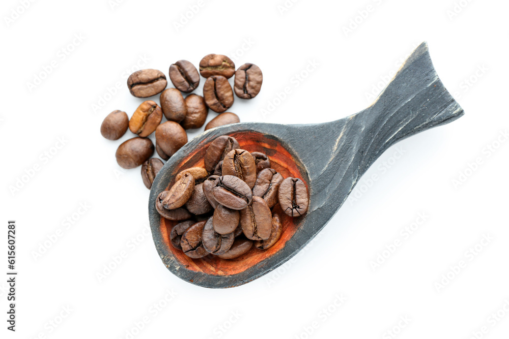 Spoon with coffee beans on white background