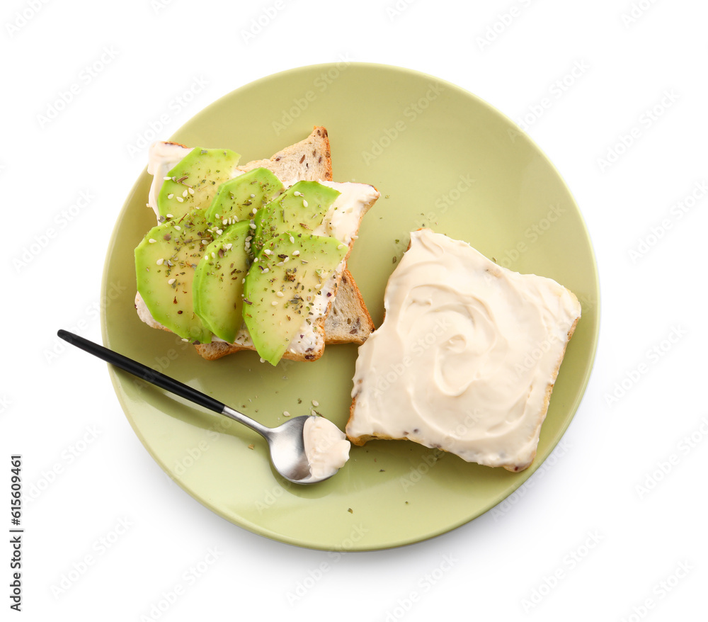 Plate of tasty toasts with cream cheese and avocado on white background