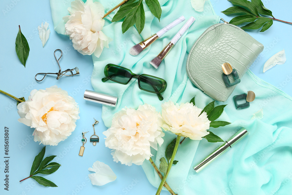 Composition with stylish female accessories, cosmetics and beautiful peony flowers on color backgrou