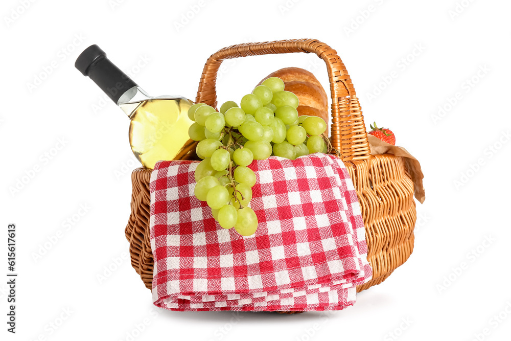 Wicker basket with tasty food for picnic and wine on white background