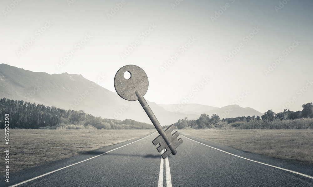 Conceptual background image of concrete key sign on asphalt road