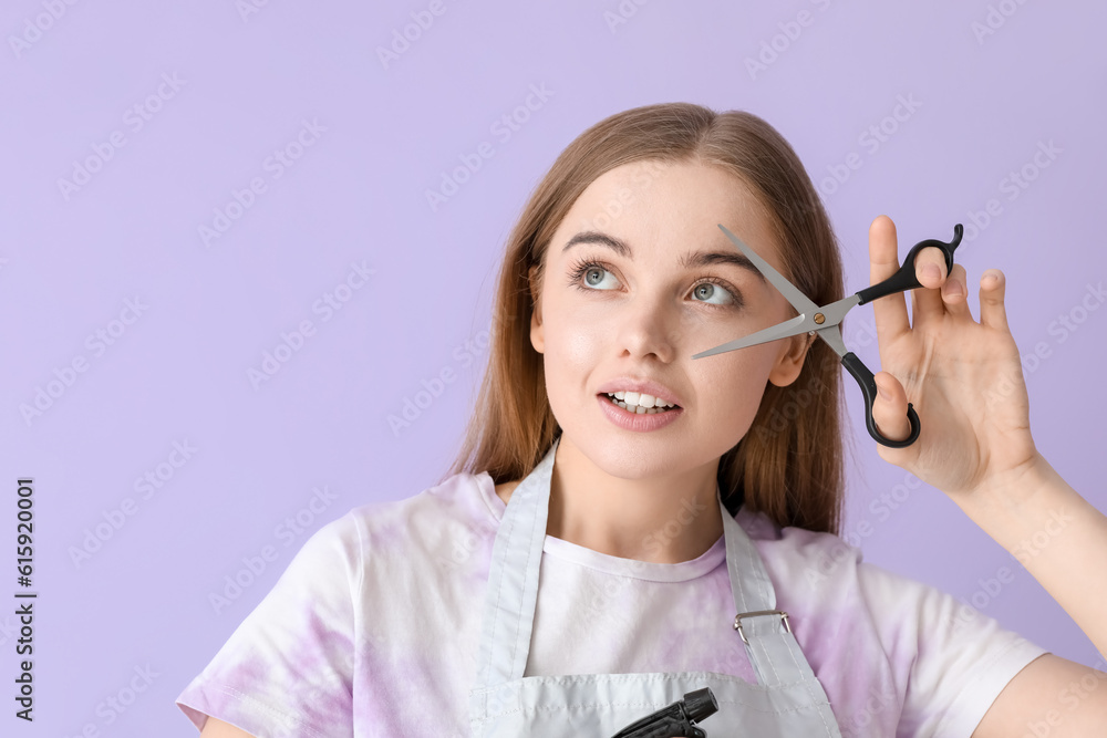 Female hairdresser with scissors on lilac background, closeup