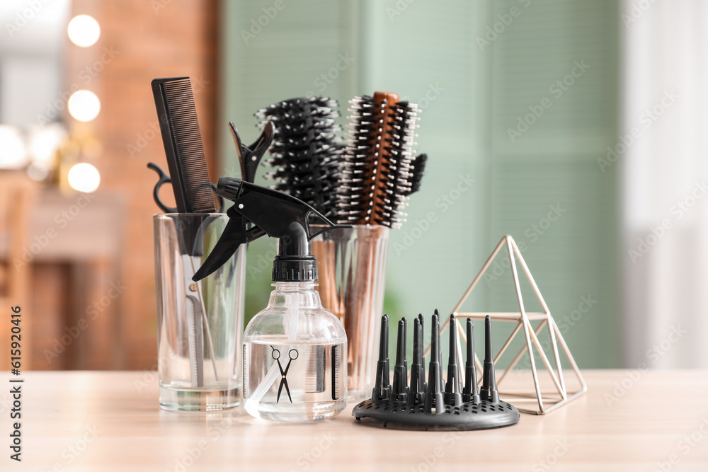 Different hairdressing tools on table in beauty salon