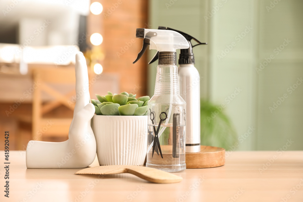 Different hairdressing tools on table in beauty salon